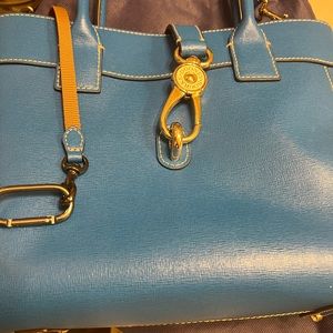 This is a Dooney bag used twice so it’s practically brand new. Clean inside out